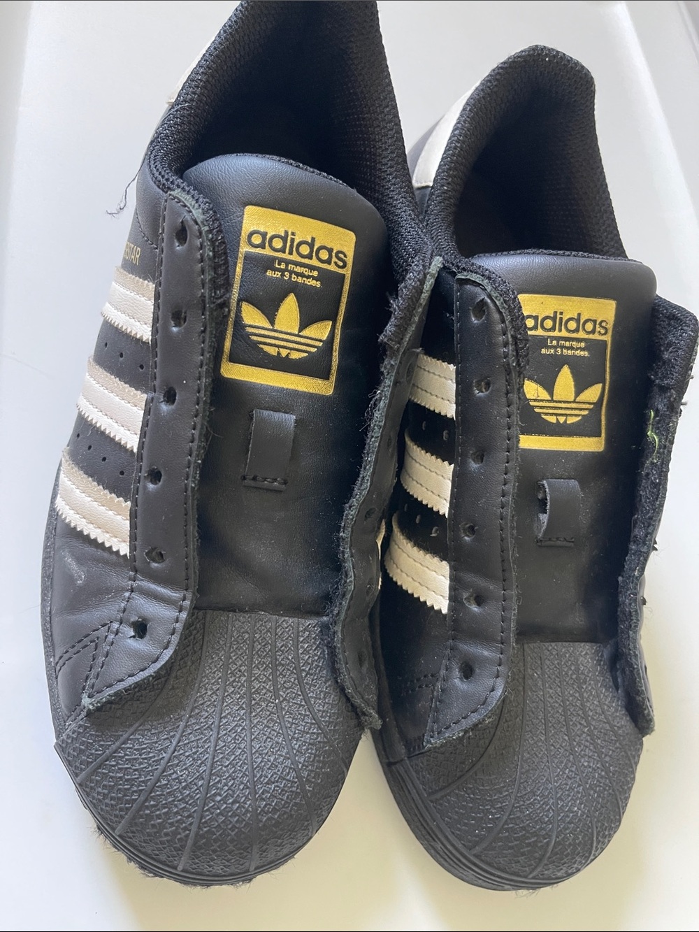 adidas Black and White Superstar Sneakers with Gold Logo